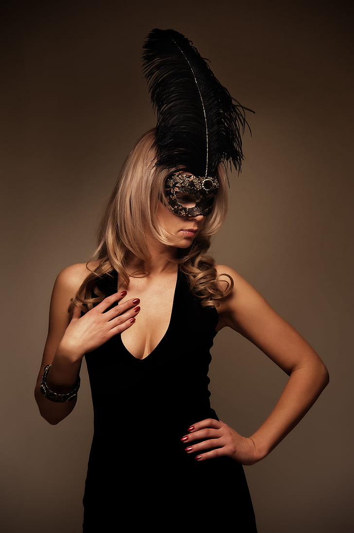 woman wearing black masquerade mask and black scoop-neck sleeveless dress