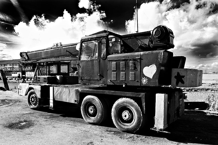 Wide angle black and white shot of an old crane, this image was captured in Faversham, Kent, England