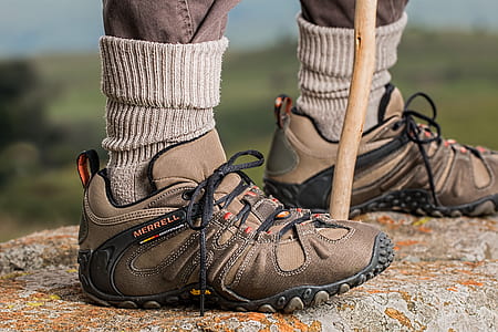 pair of brown-and-black Merrell hiking shoes