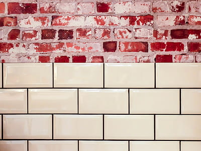 White Ceramic Wall Tile Beside Red Concrete Bricks