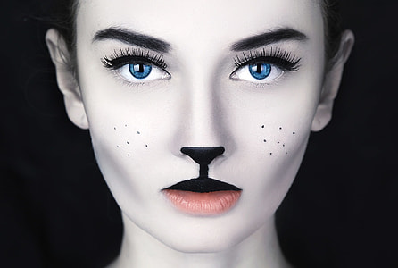 woman in black lipstick and blue eyes photo