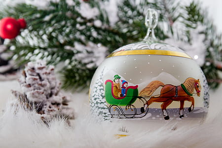 horse sleigh ornament on white fur textile
