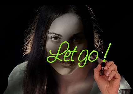 woman wearing white shirt with let go! text overlay