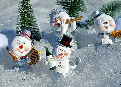four snowman ceramic figurines