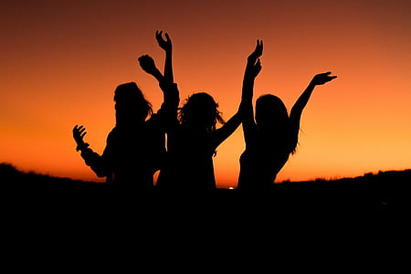 silhouette of women during sunset