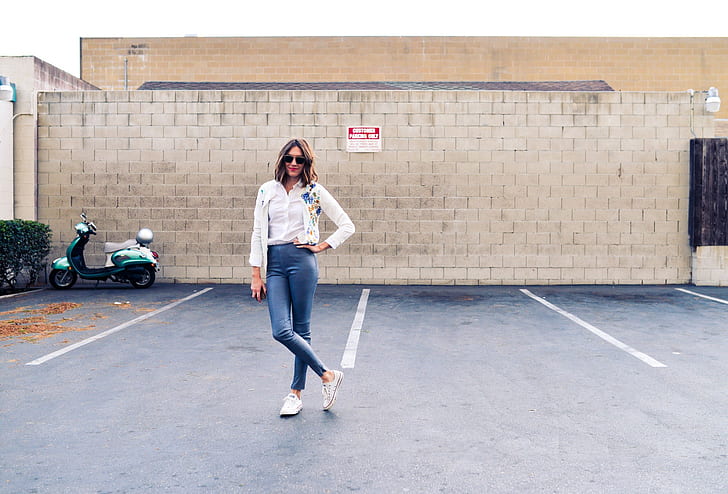 women's white button-up shirt and blue jeans