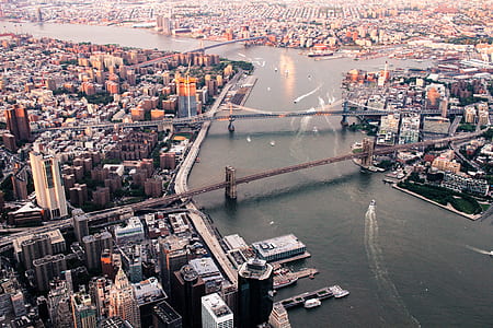 bird's eye view photo of city with suspension bridge