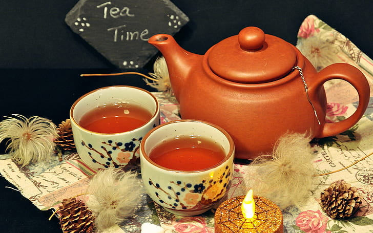 closeup photo of brown teapot with teacup with teas