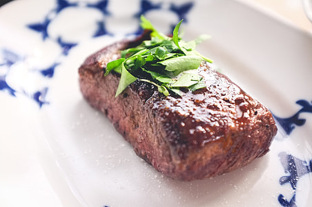 Beef steak with herb and salt close up