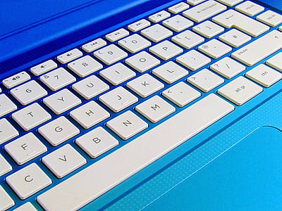 white and blue laptop computer