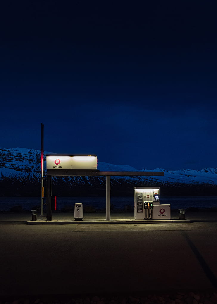 turned-on lights on gas station