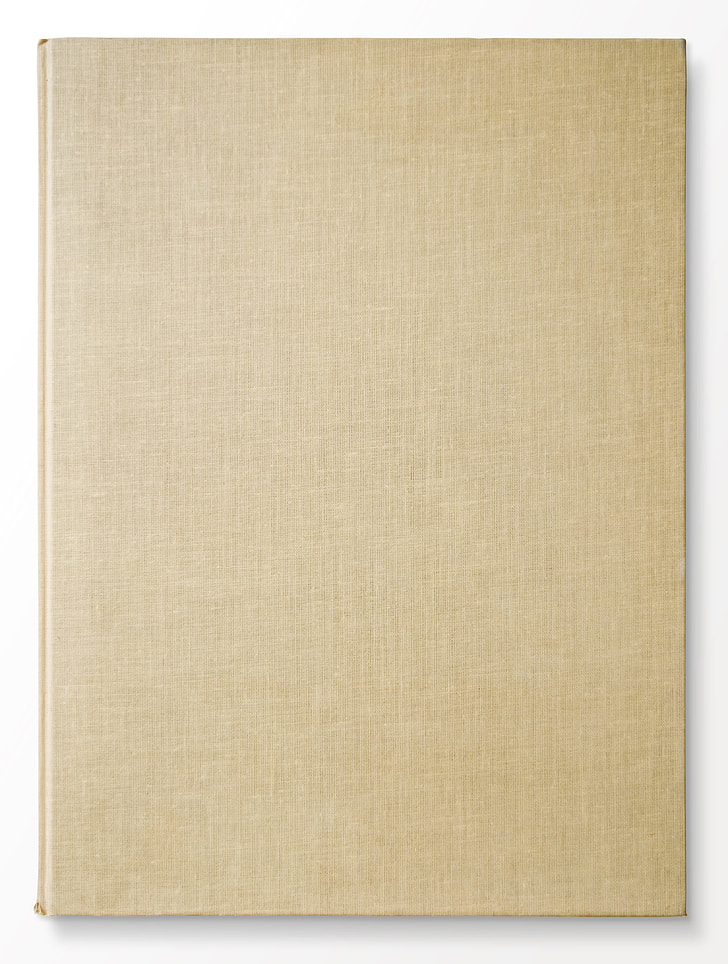 rectangular beige handbound book