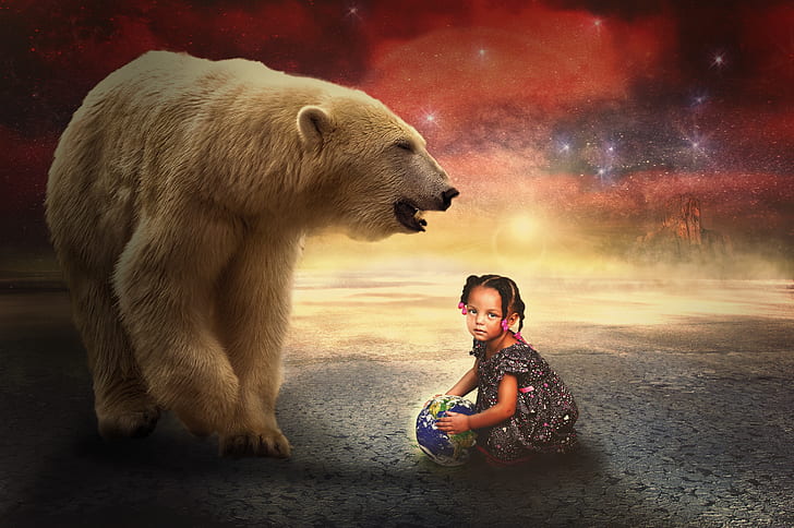 girl playing ball beside polar bear