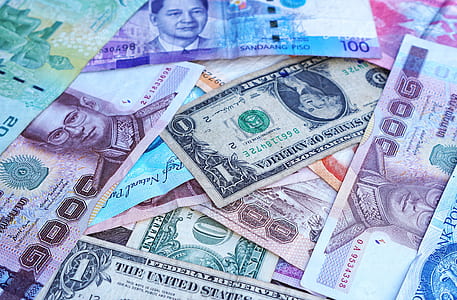One U.s. Dollar Beside 100 Philippine Pesos