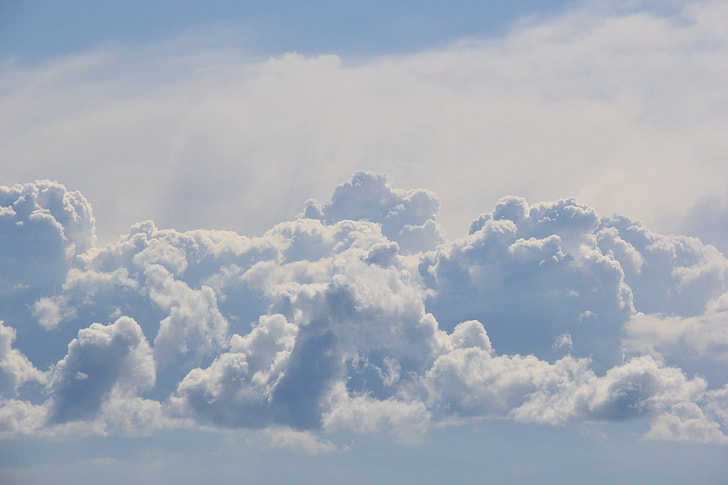 white cumulus clouds during daytime