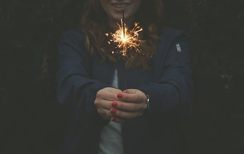 girl holding sprinkle fireworks
