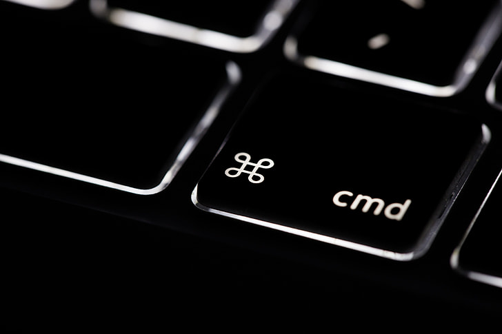 Macro shot of the command key on the backlit keyboard of a laptop computer. Image captured with a Canon 6D