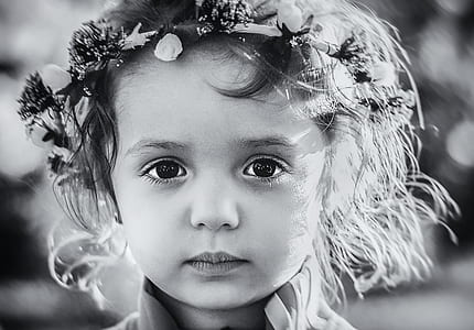 Photo Gray Scale of a Child With Floral Tiara
