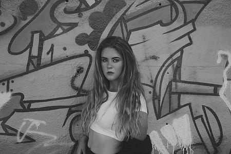 grayscale photo of woman wearing white crop top