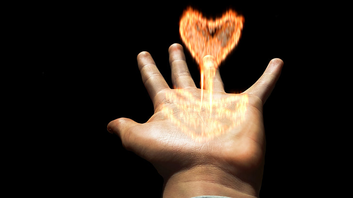 left hand with heart-shape flame