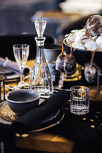 Fancy restaurant dinner table decorated with quail eggs and feathers