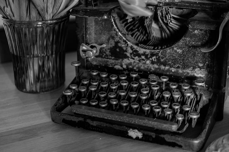 grayscale photo of vintage black typewriter