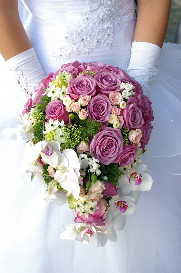 close up photo of person holding bouquet
