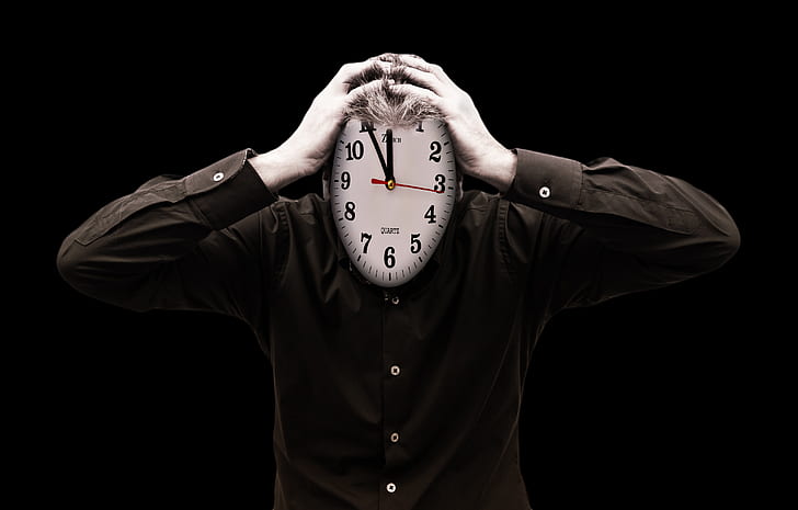 person holding wall clock