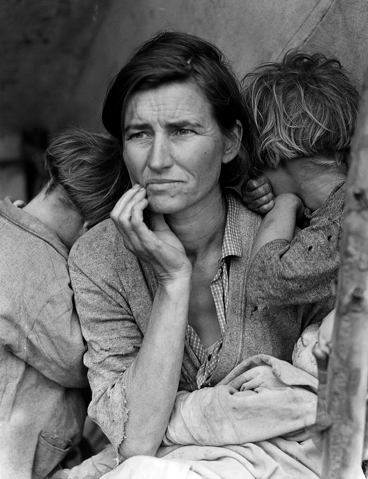 grayscale photo of a woman with her children