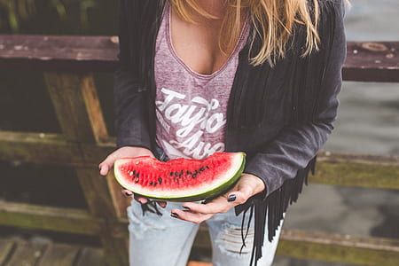 person holding watermelon