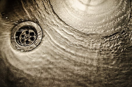 close up photograph of draining water in sink