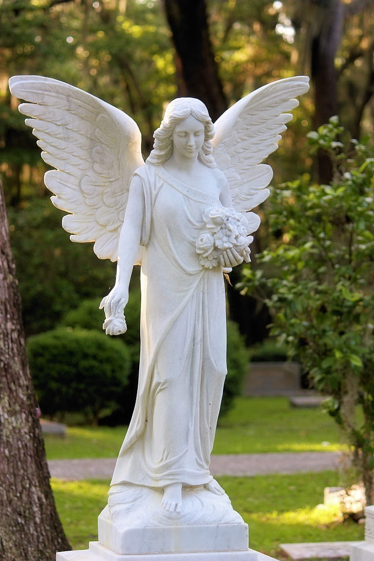 female angel statue in garden