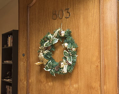 Christmas Wreath Hanging on Brown Wooden Door of Room 803