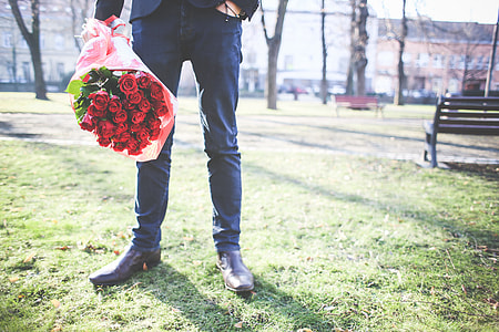 Gentleman Holding a Bouquet of Roses