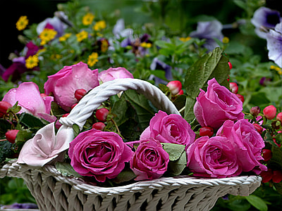 pink rose flower arrangement in white basket