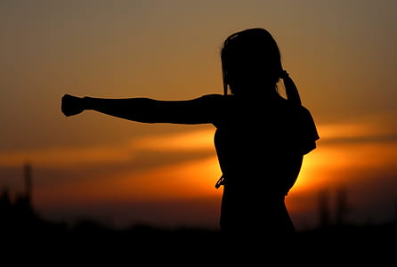 silhouette of female punching photo