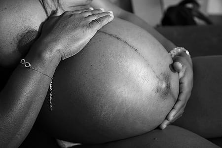 grayscale photography of a pregnant woman