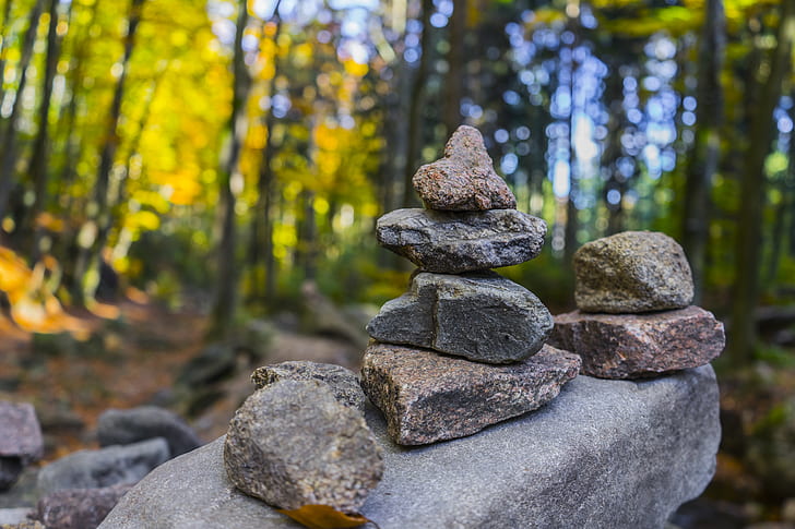 balance-blurred-background-boulders-clos