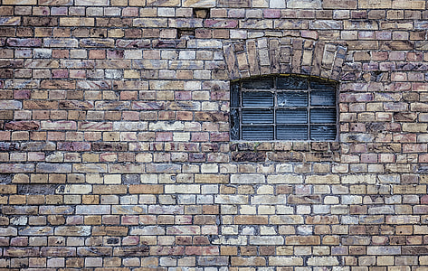 black 16-pane window with concrete frame photo