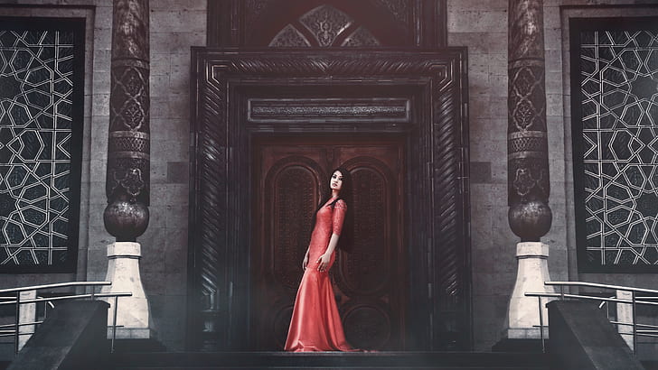 woman wearing red dress standing in-front of door