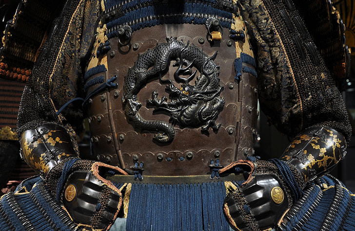brown, blue, black, and yellow samurai armor with dragon embossed