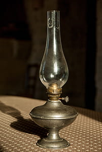 grey oil lamp on table