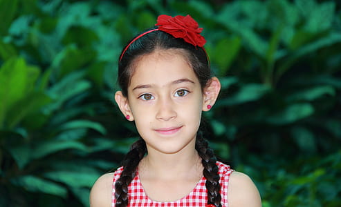 selective focus photography of girl wearing red alice band