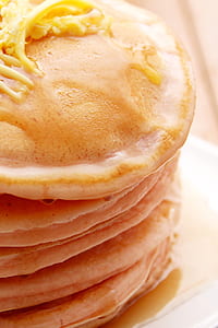 closeup photography of stack of pancakes with butter on top