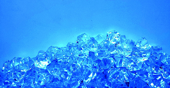 pile of clear crystals with blue background