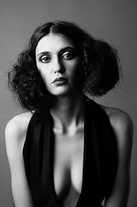 grayscale photography of woman wearing deep v-neck halter top