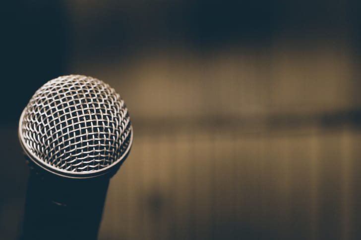 selective focus photography of silver dynamic microphone