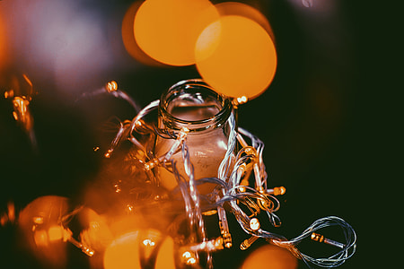 boke photography of orange lights with glass