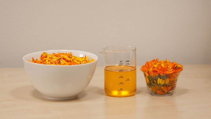 round white ceramic bowl with orange petaled flowers