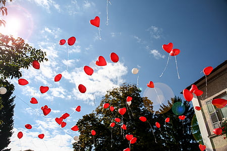floating red heart balloons